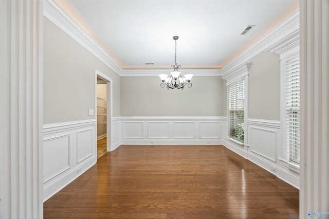 4513 Stone Park Cir, Owens Cross Roads, AL 35763 - unfurnished dining area featuring a chandelier, dark wood-style flooring, a wainscoted wall, ornamental molding, and a decorative wall