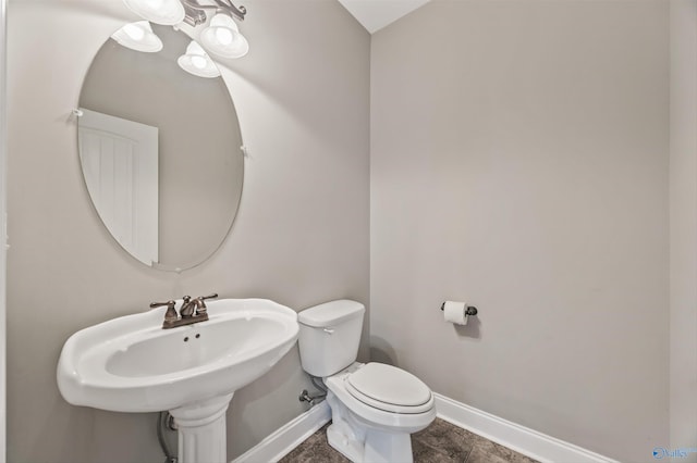 4513 Stone Park Cir, Owens Cross Roads, AL 35763 - bathroom featuring baseboards and toilet