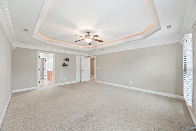 4513 Stone Park Cir, Owens Cross Roads, AL 35763 - unfurnished bedroom featuring a tray ceiling, crown molding, light carpet, ceiling fan, and connected bathroom