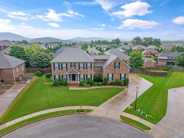 4513 Stone Park Cir, Owens Cross Roads, AL 35763 - georgian-style home featuring brick siding, concrete driveway, a mountain view, and a residential view