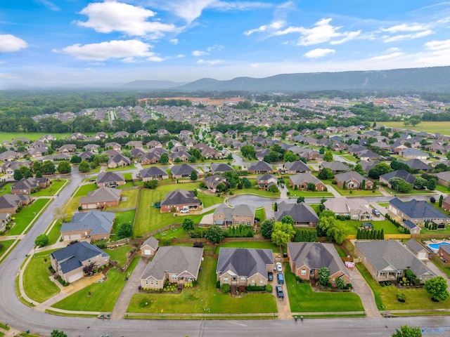 4513 Stone Park Cir, Owens Cross Roads, AL 35763 - aerial overview of property's location with a mountainous background and nearby suburban area