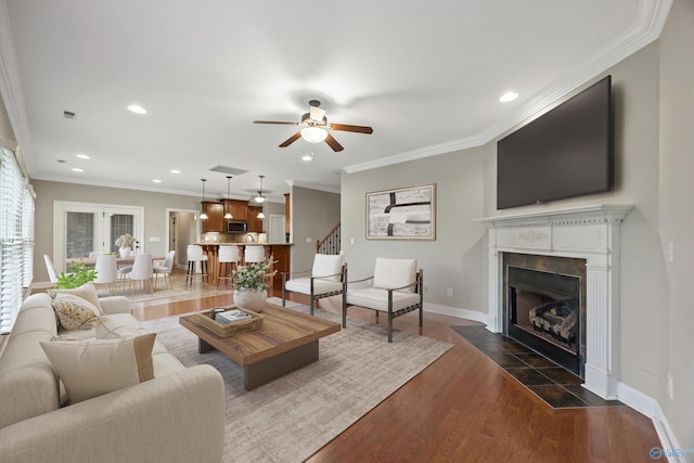 4513 Stone Park Cir, Owens Cross Roads, AL 35763 - living room with a ceiling fan, ornamental molding, recessed lighting, a fireplace with flush hearth, and dark wood-type flooring