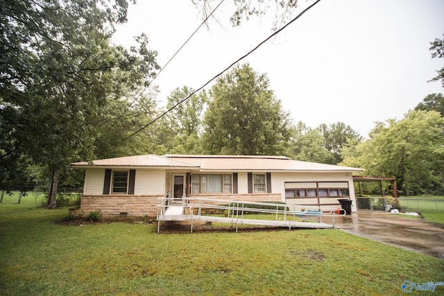 view of front of home with a front lawn and a carport