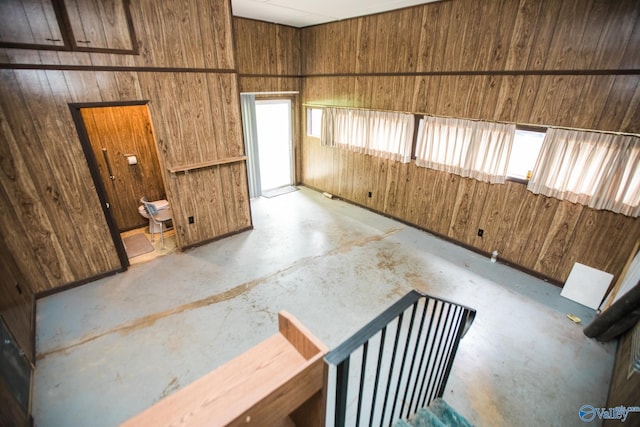 empty room featuring wooden walls
