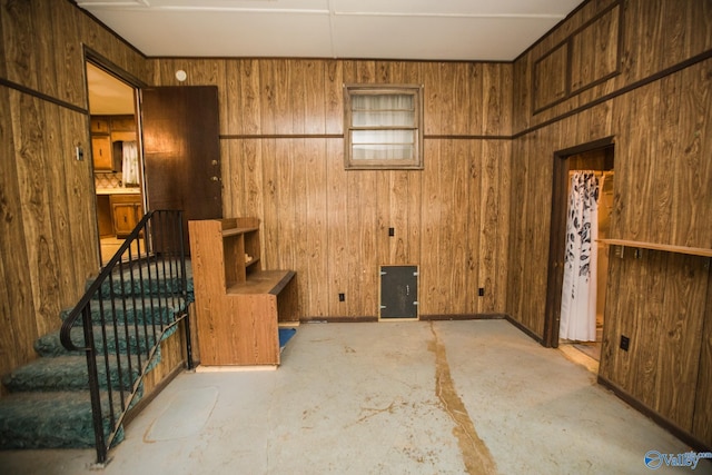 interior space featuring wood walls