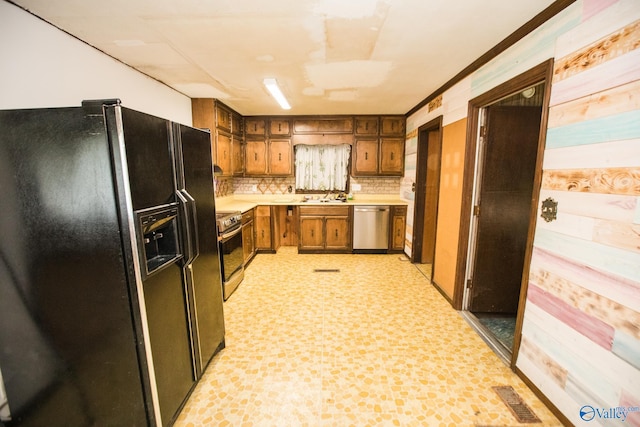 kitchen with sink, decorative backsplash, and appliances with stainless steel finishes