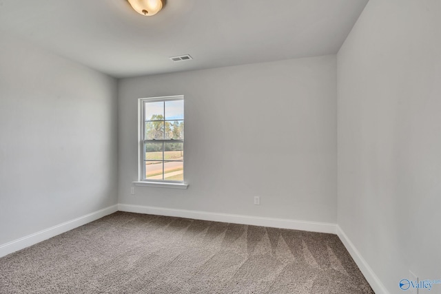 unfurnished room with carpet flooring