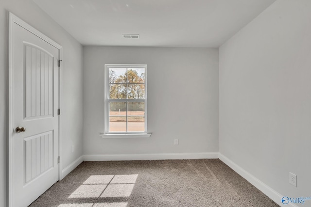 empty room featuring carpet floors