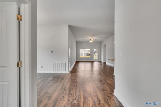 interior space featuring ceiling fan and dark hardwood / wood-style flooring