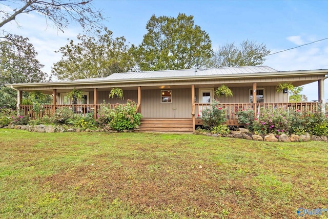 view of front of house with a porch and a front lawn