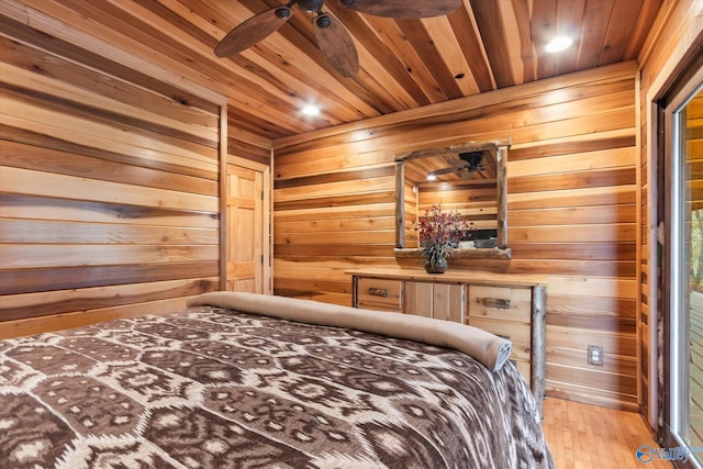 bedroom with wood ceiling, wood walls, and wood-type flooring