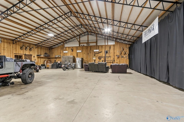garage featuring wood walls