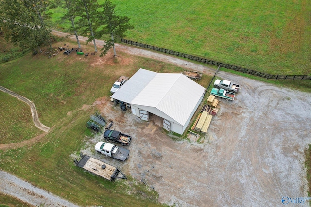 birds eye view of property with a rural view