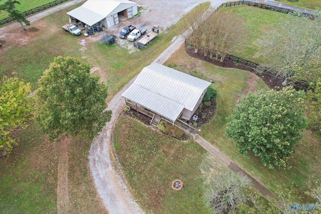 birds eye view of property with a rural view