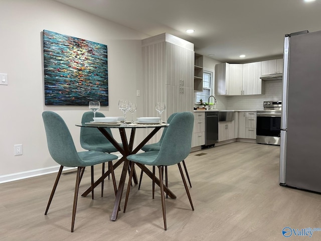 dining room featuring light hardwood / wood-style floors