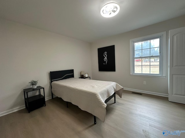 bedroom with light wood-type flooring