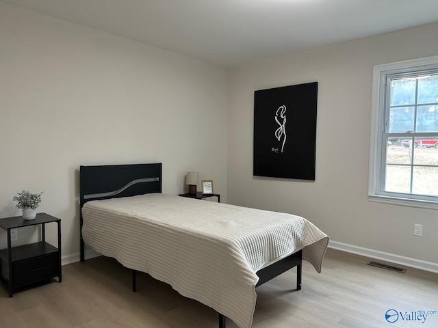 bedroom featuring light hardwood / wood-style flooring