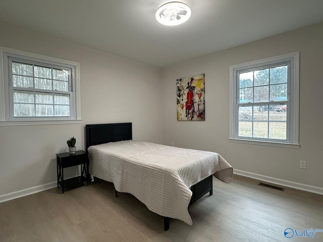 bedroom featuring light wood-type flooring