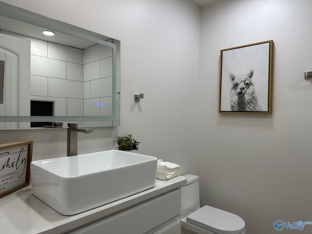 bathroom with vanity and toilet