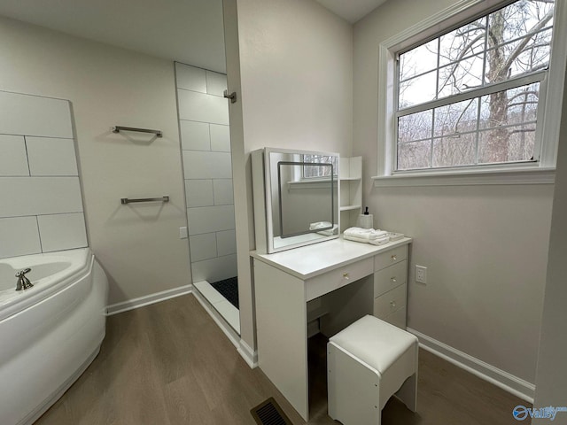 bathroom with wood-type flooring and separate shower and tub