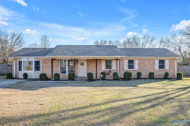 ranch-style house with a front lawn