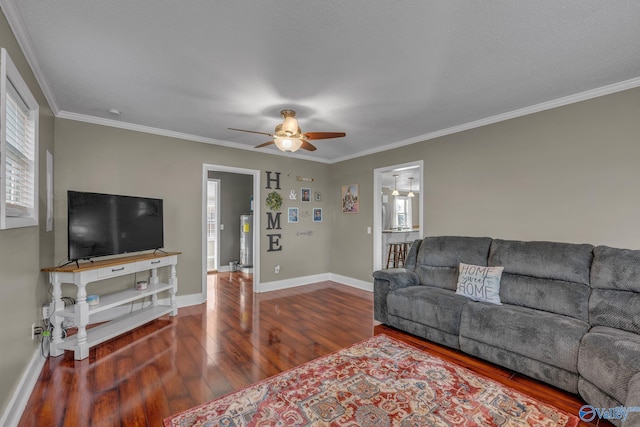 living room featuring ceiling fan, water heater, wood-type flooring, and ornamental molding