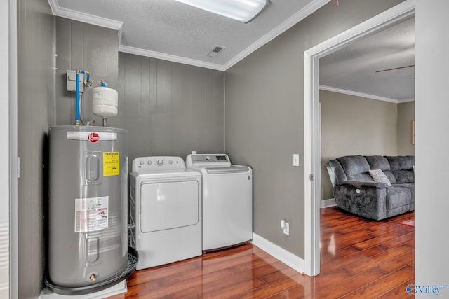 laundry area with hardwood / wood-style flooring, washer and dryer, ceiling fan, and water heater