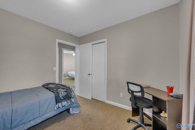 carpeted bedroom with a textured ceiling