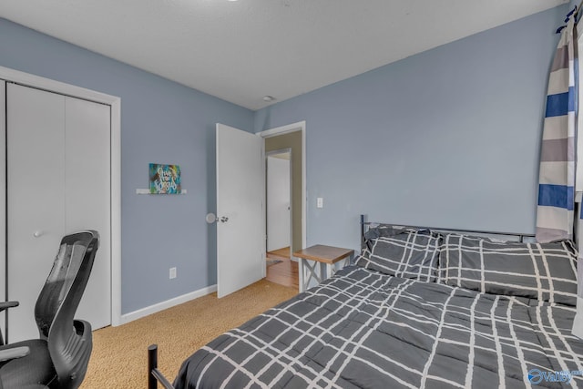 carpeted bedroom with a closet