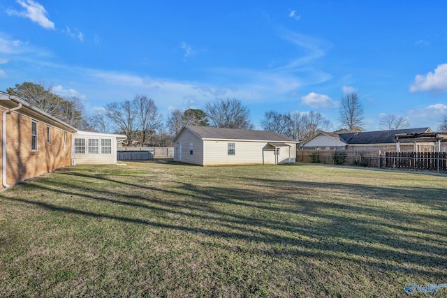 view of yard with an outbuilding