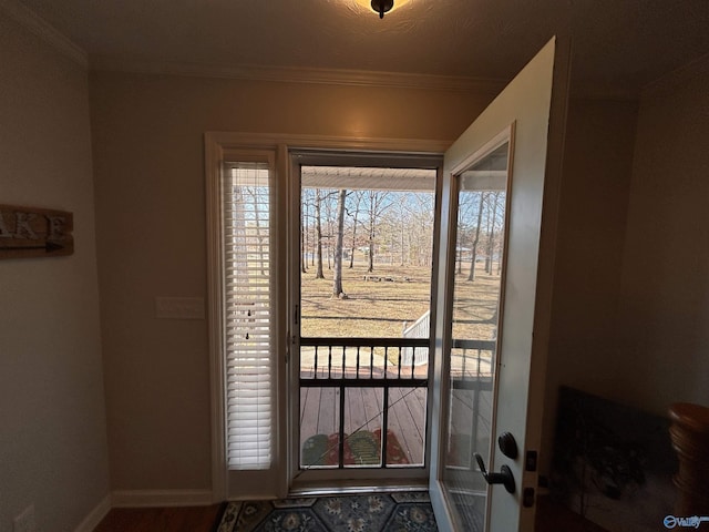 doorway to outside with ornamental molding