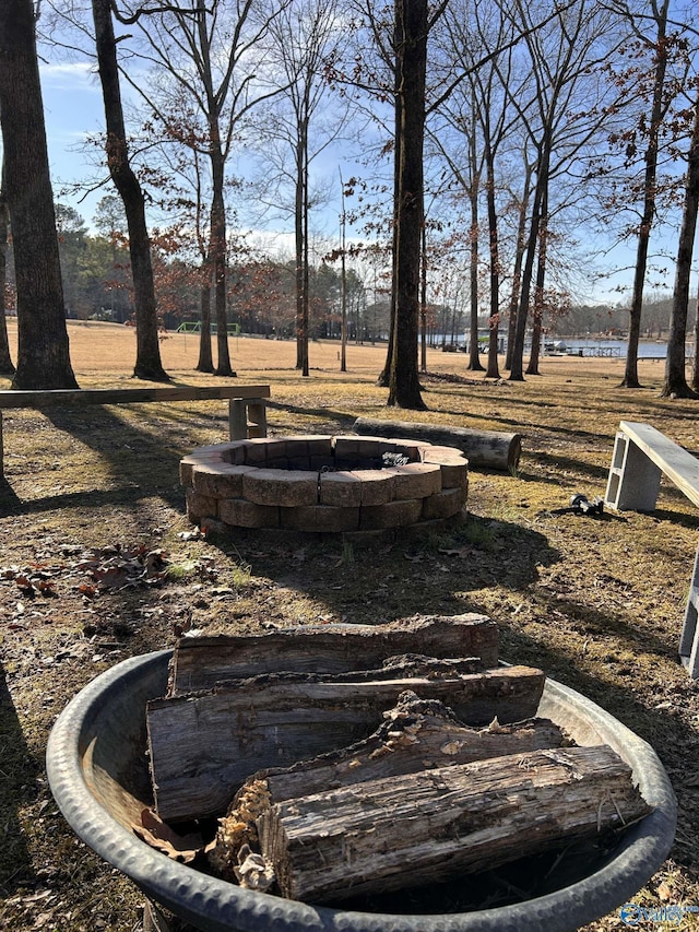 view of yard featuring an outdoor fire pit