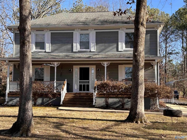 view of front of house with a porch and a front lawn