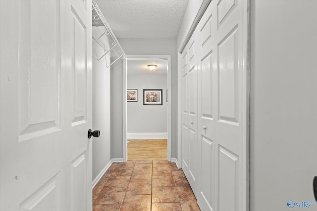 corridor with a textured ceiling