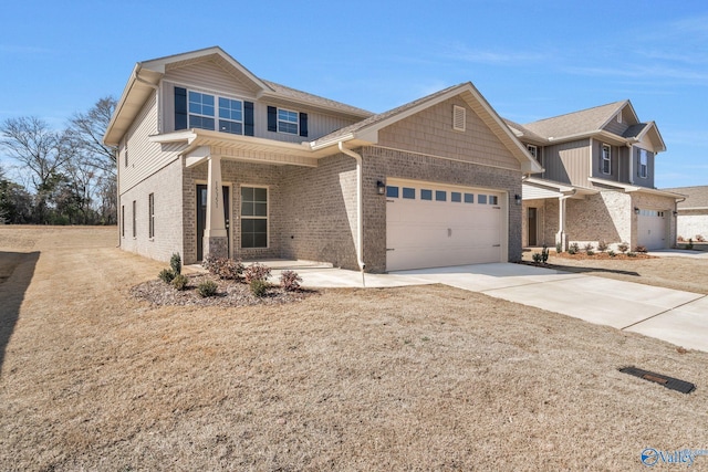 view of front of house featuring an attached garage, concrete driveway, and brick siding