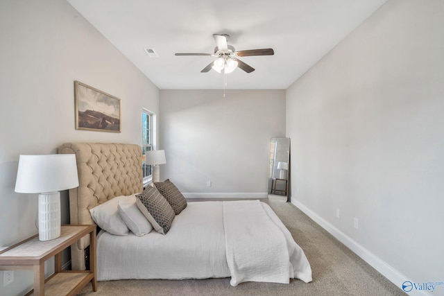 carpeted bedroom with ceiling fan, visible vents, and baseboards