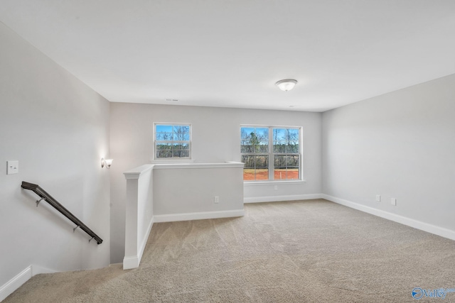 spare room with carpet floors and baseboards