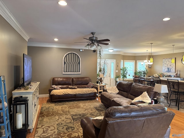 living room with recessed lighting, light wood finished floors, crown molding, ceiling fan, and baseboards