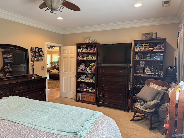bedroom featuring light carpet, ornamental molding, visible vents, and recessed lighting