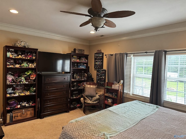 bedroom featuring visible vents, a ceiling fan, ornamental molding, and carpet floors