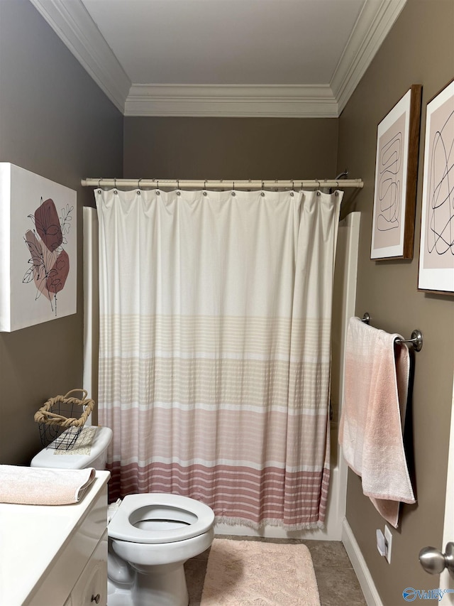 bathroom featuring crown molding, toilet, and vanity