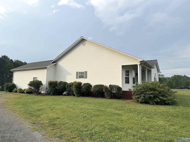 view of property exterior with a lawn