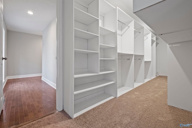 spacious closet featuring light hardwood / wood-style floors