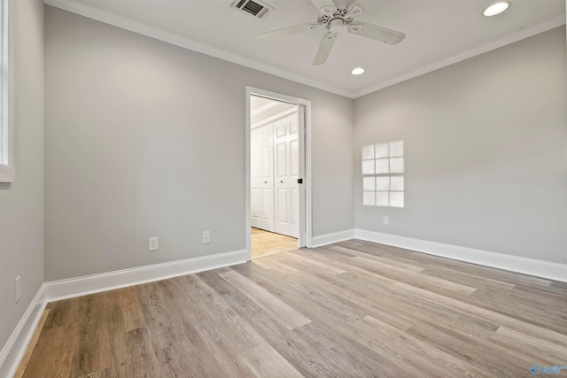 unfurnished room with crown molding, ceiling fan, and light hardwood / wood-style floors