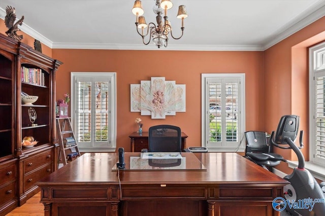 office featuring a notable chandelier, crown molding, and light wood-style floors