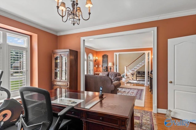 office area with a notable chandelier, light wood-style floors, baseboards, and ornamental molding