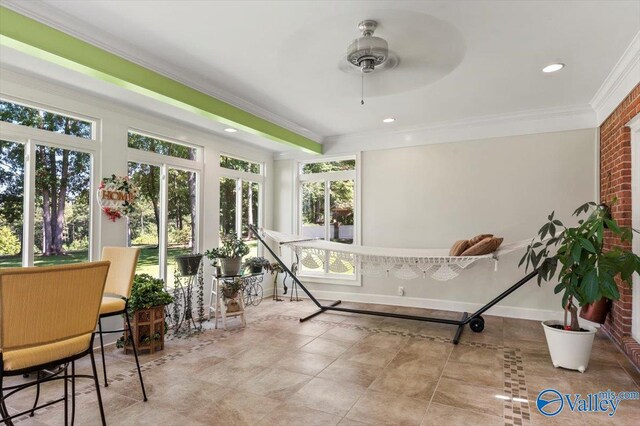 bedroom with light colored carpet, a raised ceiling, crown molding, and ceiling fan