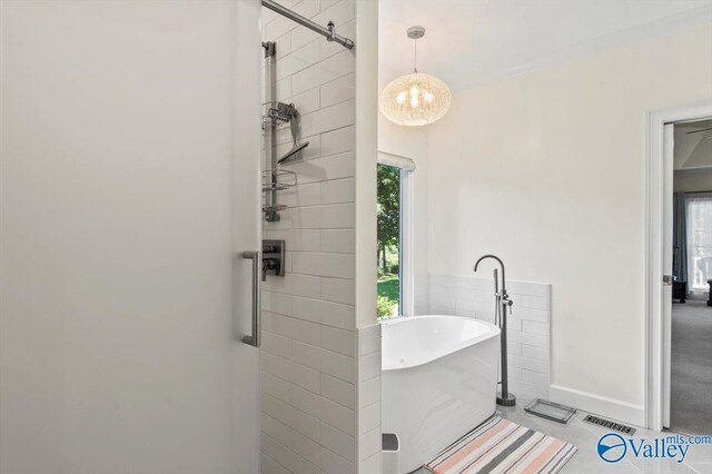 bathroom with toilet, vanity, and tile patterned floors