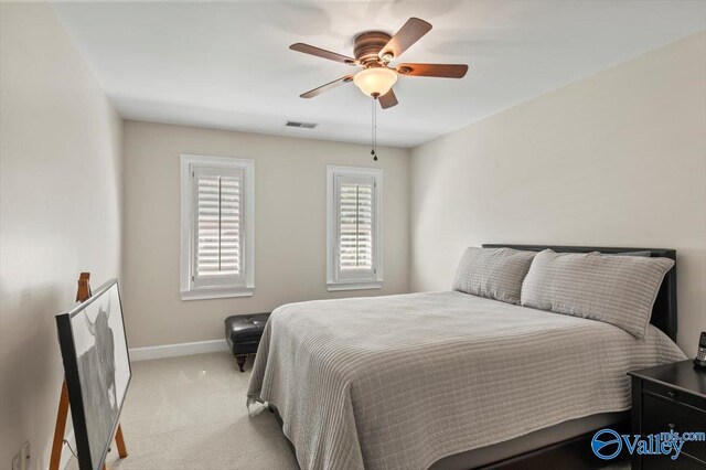 carpeted bedroom with ceiling fan