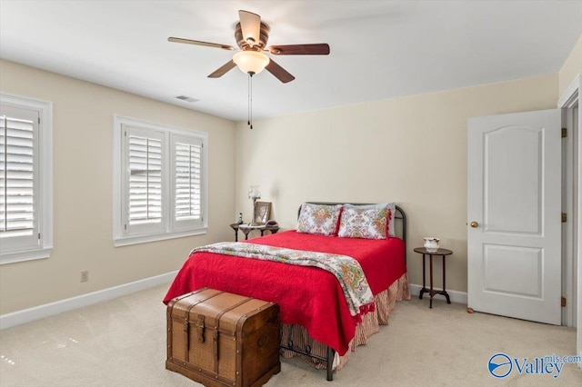 bedroom featuring a ceiling fan, baseboards, visible vents, and carpet floors